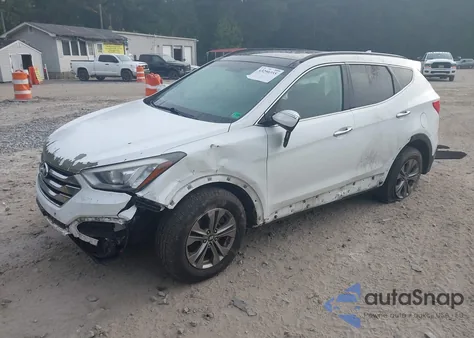2014 Hyundai Santa Fe Sport 2.4L z USA, uszkodzony, nr VIN 5XYZUDLBXEG210414